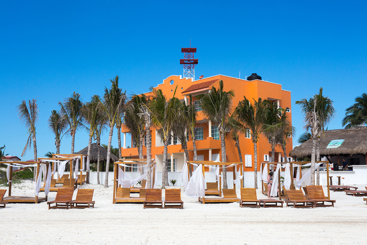 There are lots of places along the Puerto Morelos beach, where you can rent loungers like these relaxing and shaded chairs.