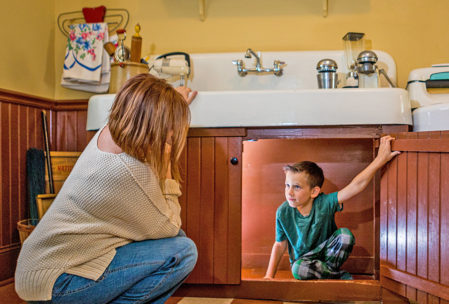 Hiding out under the sink at the A Christmas Story House